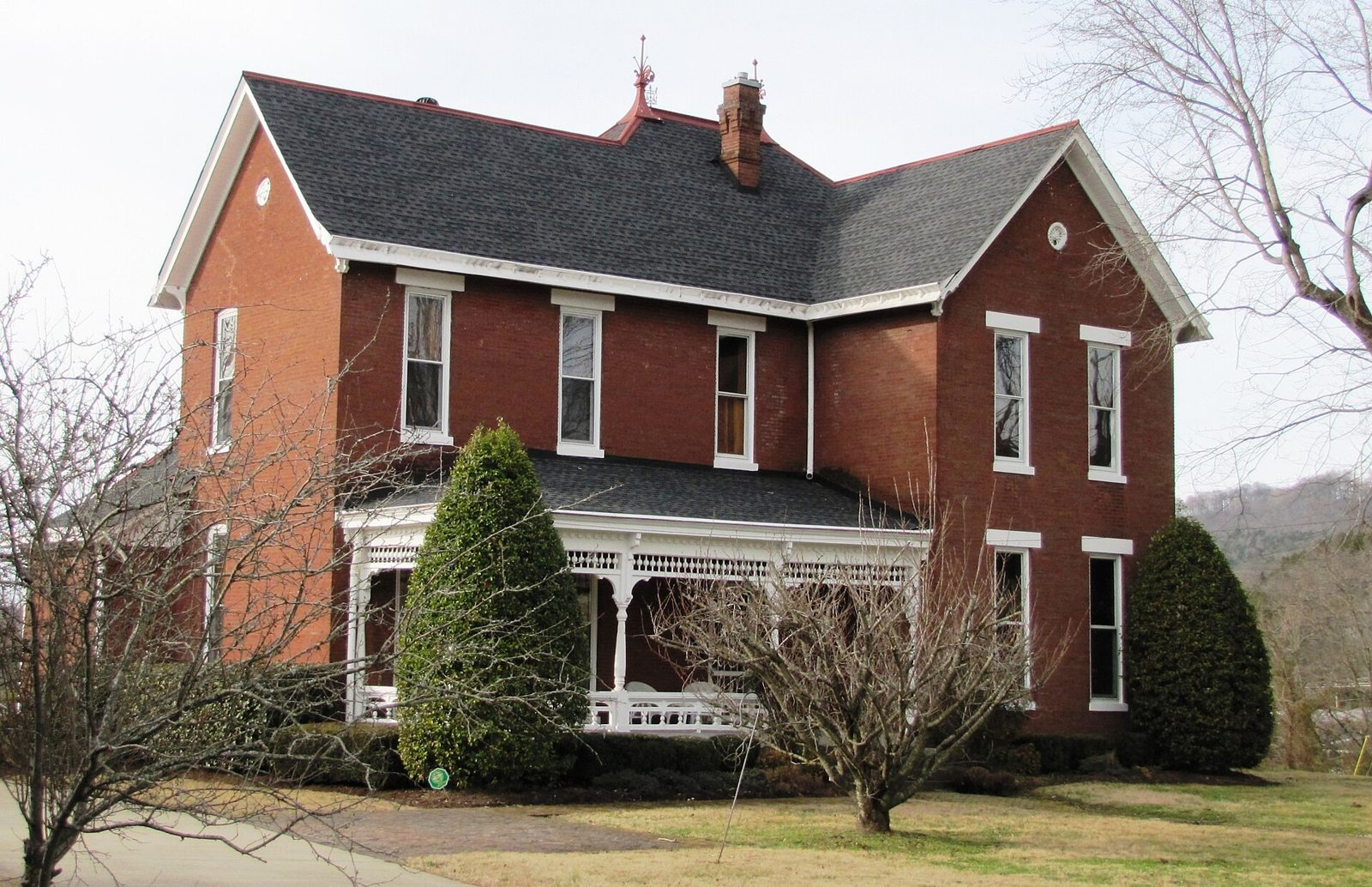 Red-brick detached house with slate roof