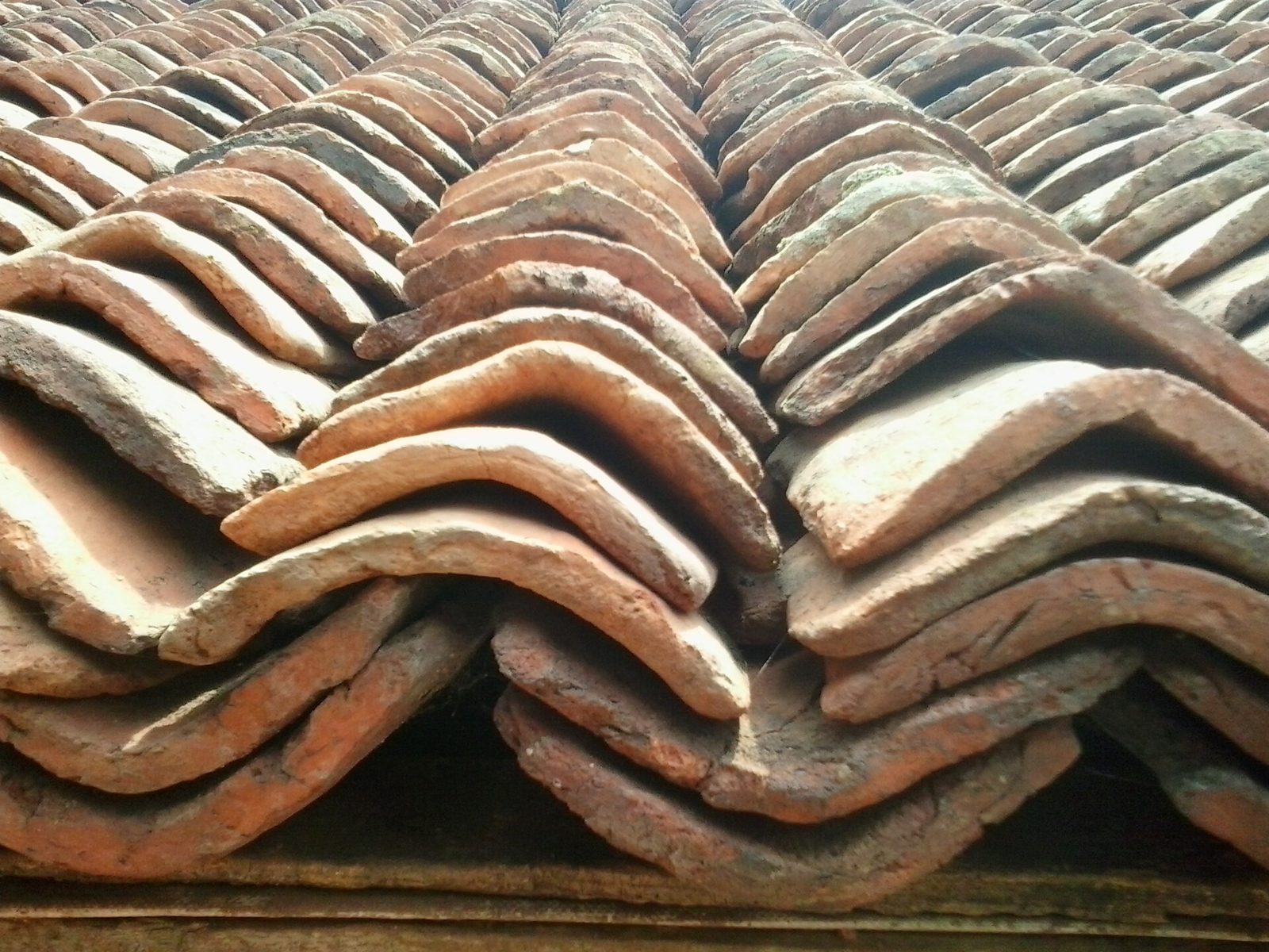 Close-up of stacked clay roof tiles