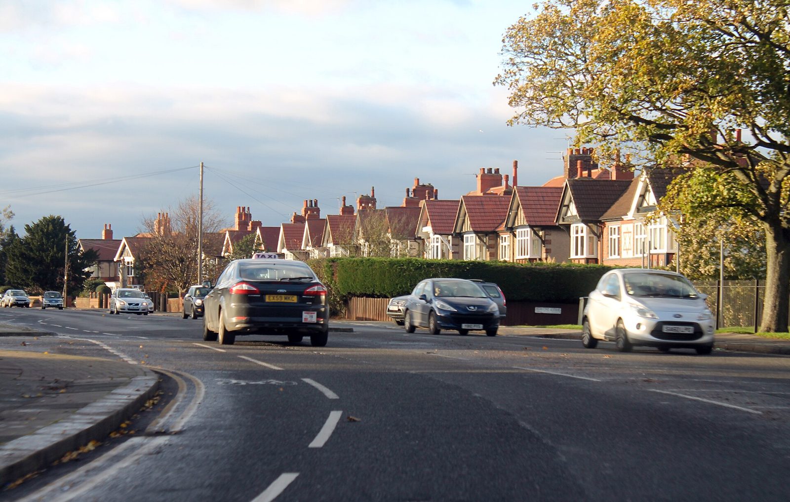 Street of English houses with pitched roofs