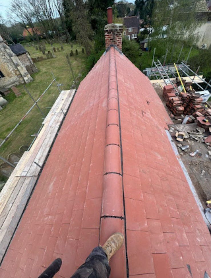 New red tiled roof with ridge tiles fitted by our team