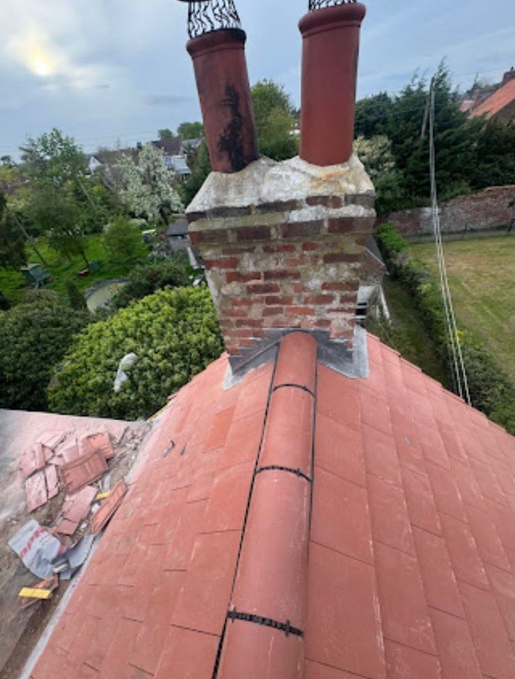 New red tiled roof with ridge tiles fitted by our team
