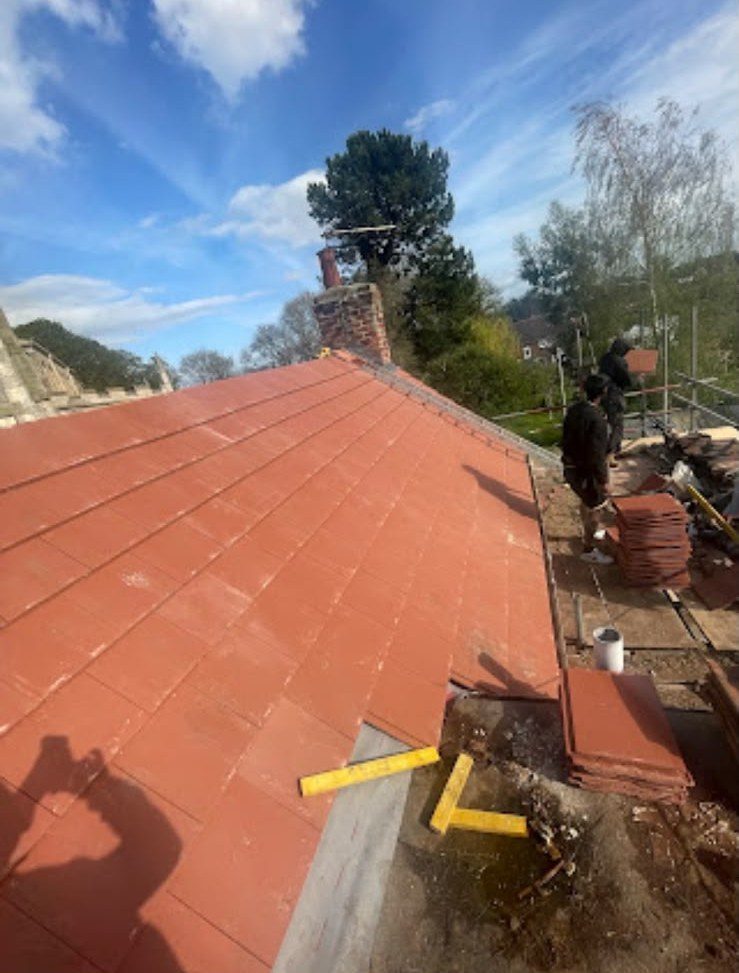 New red tiled roof with ridge tiles fitted by our team