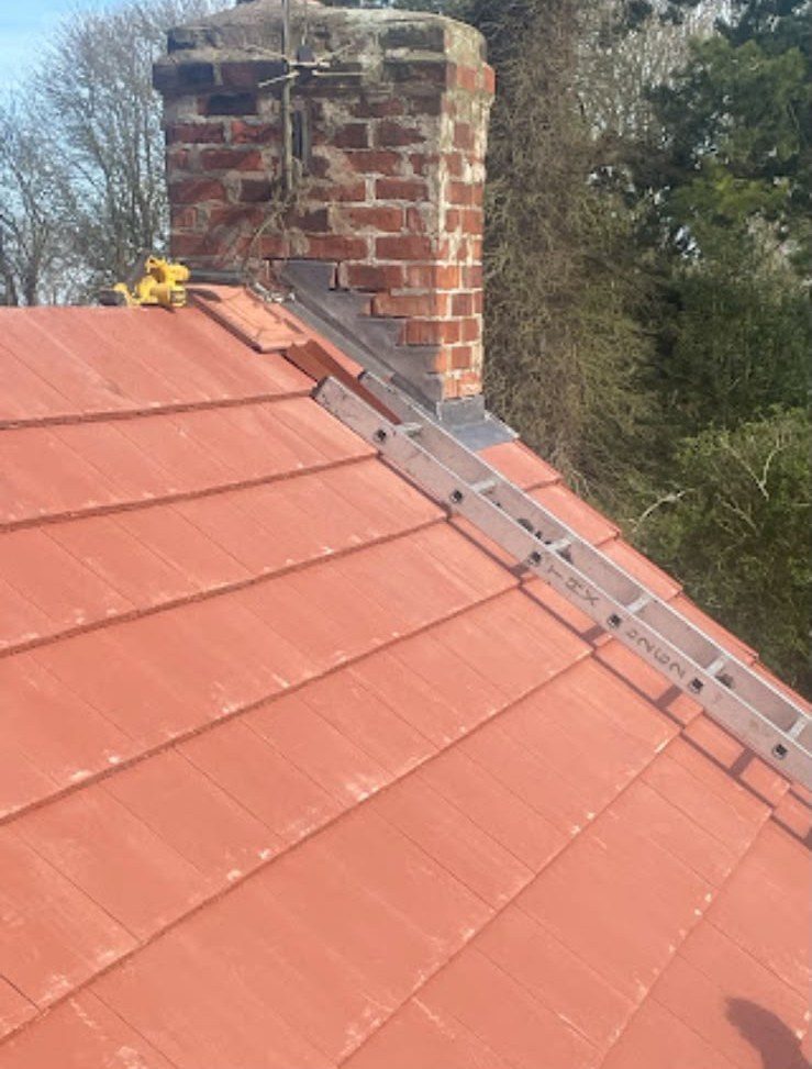 New red tiled roof with ridge tiles fitted by our team