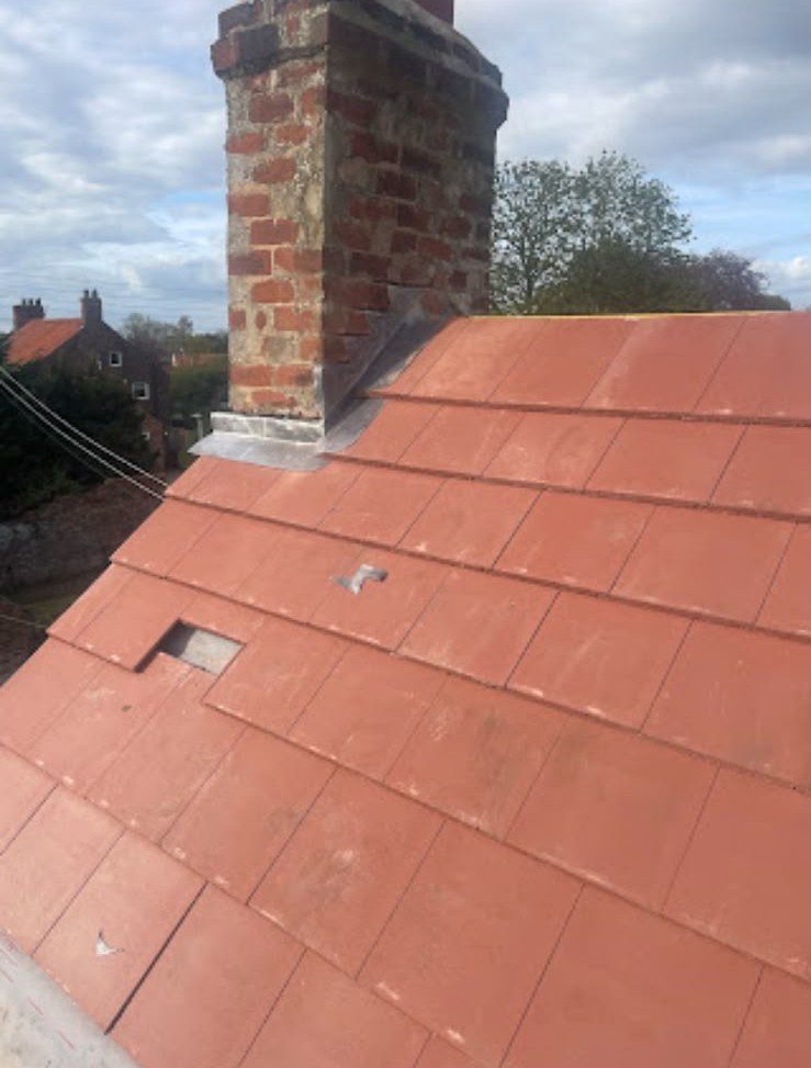 New red tiled roof with ridge tiles fitted by our team