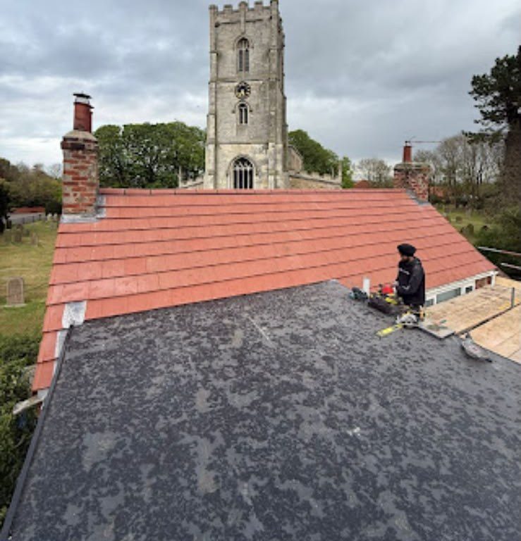 New red tiled roof with ridge tiles fitted by our team
