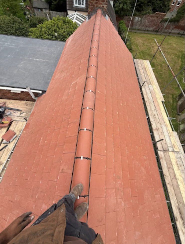 New red tiled roof with ridge tiles fitted by our team