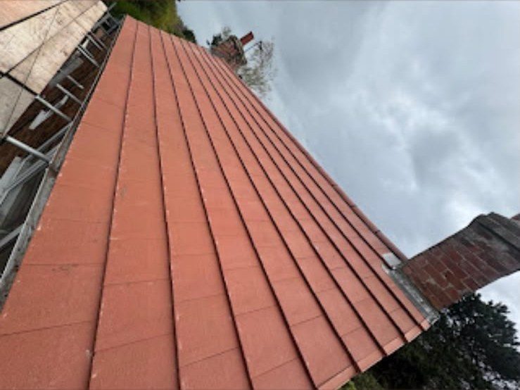 New red tiled roof with ridge tiles fitted by our team