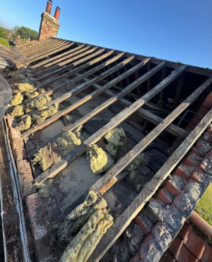 Old roof stripped back to the rafters ready for re-roofing