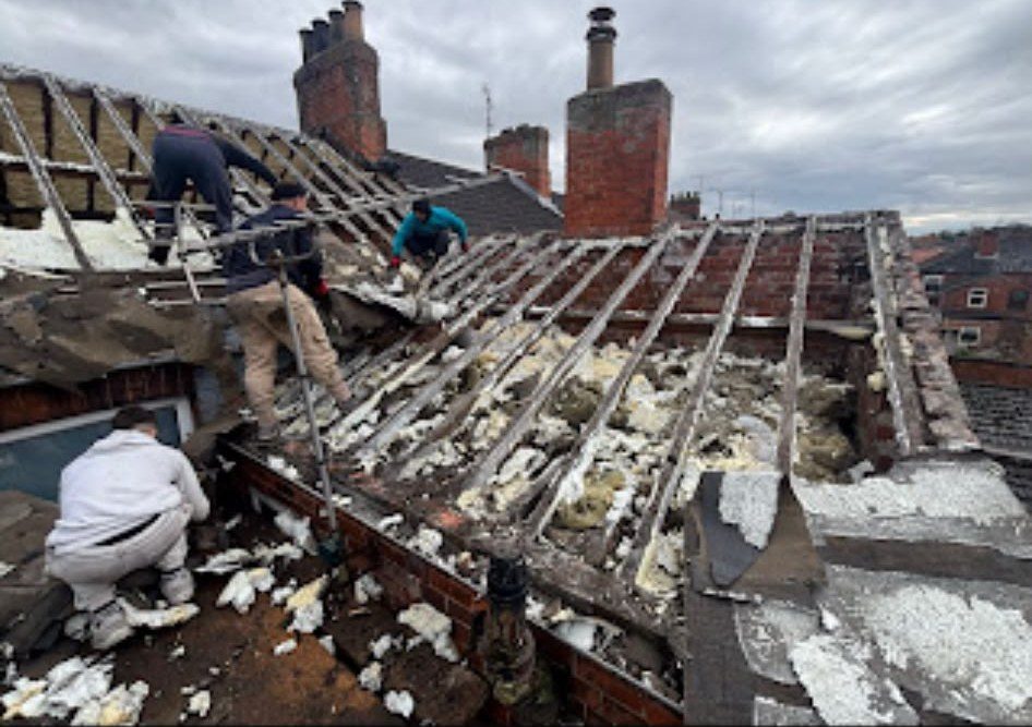 Our team stripping an old roof