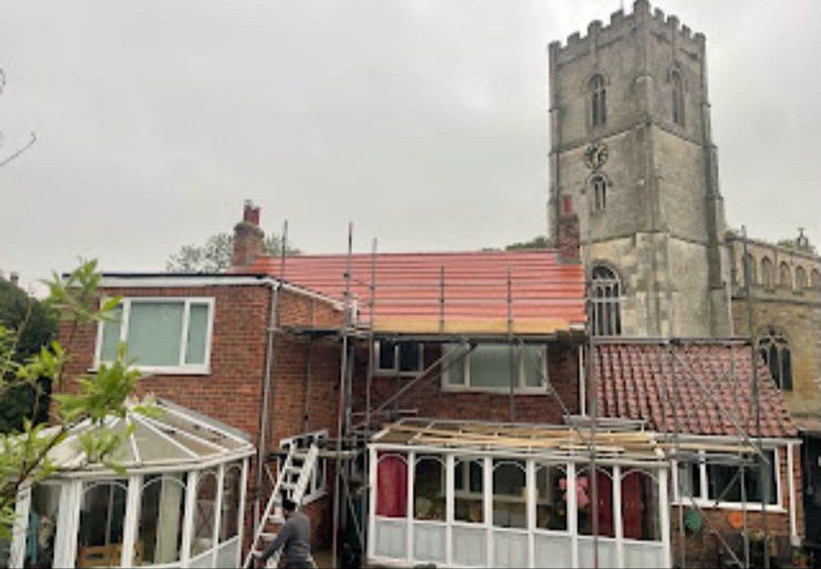 Scaffolding up on a brick house for a full re-roof