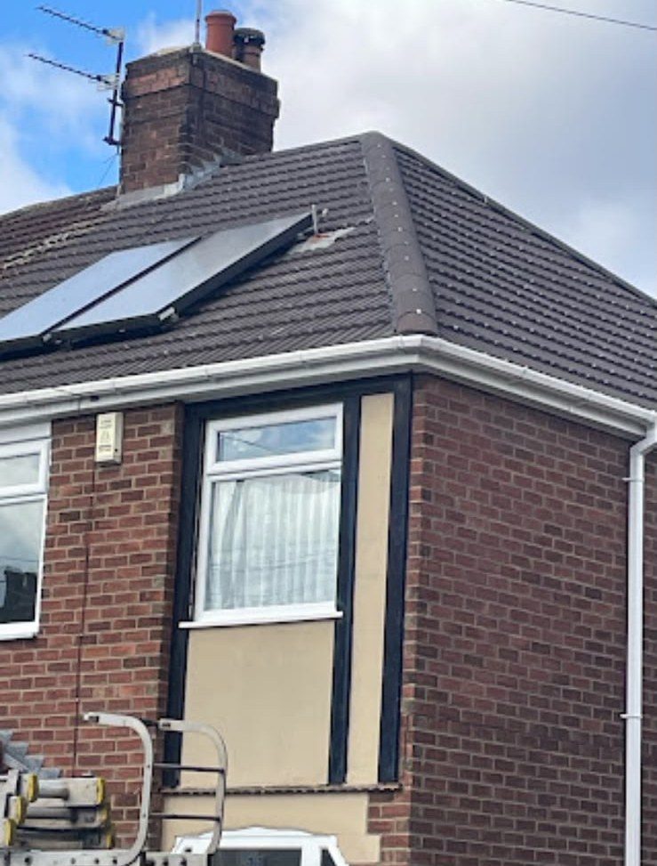 Brick house with a newly completed roof