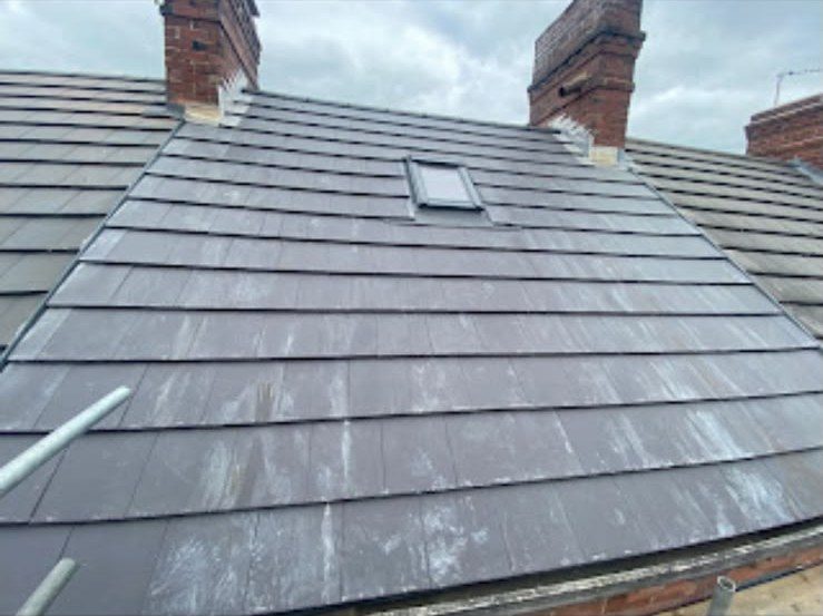New grey tiled roof being fitted by our roofers