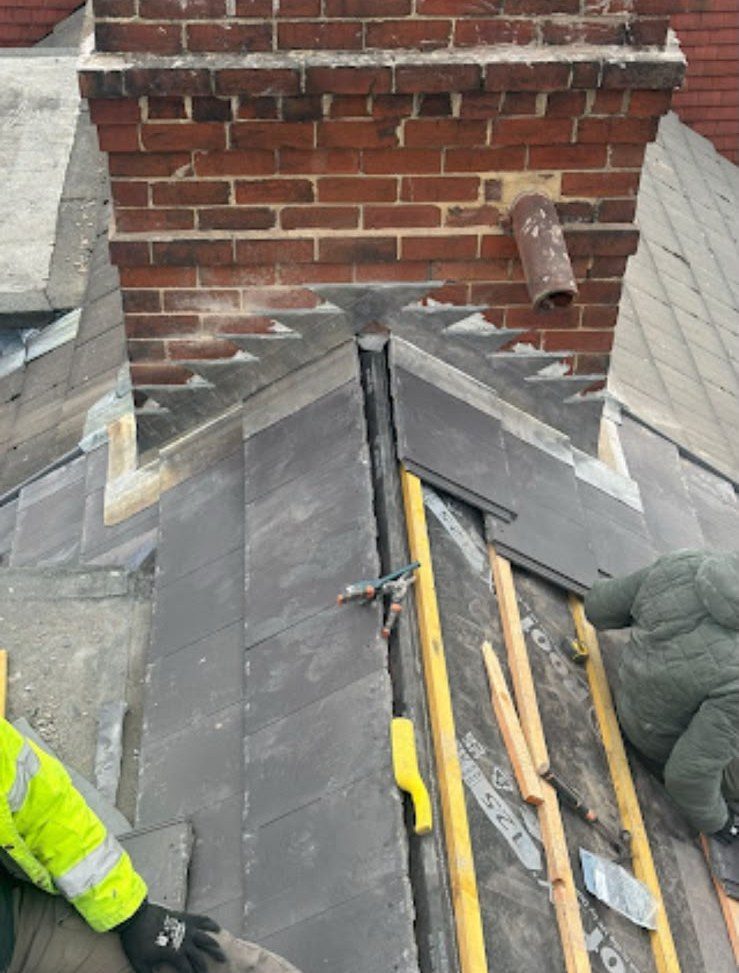 New grey tiled roof being fitted by our roofers