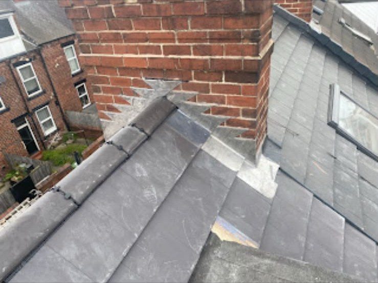 New grey tiled roof being fitted by our roofers