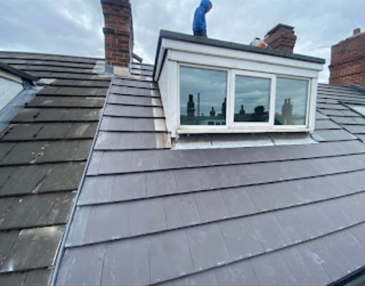 New grey tiled roof being fitted by our roofers