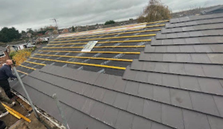 New grey tiled roof being fitted by our roofers