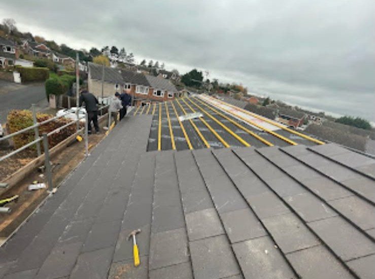 New grey tiled roof being fitted by our roofers