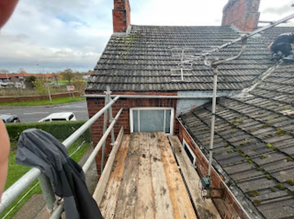 New grey tiled roof being fitted by our roofers