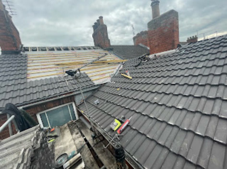 New grey tiled roof being fitted by our roofers