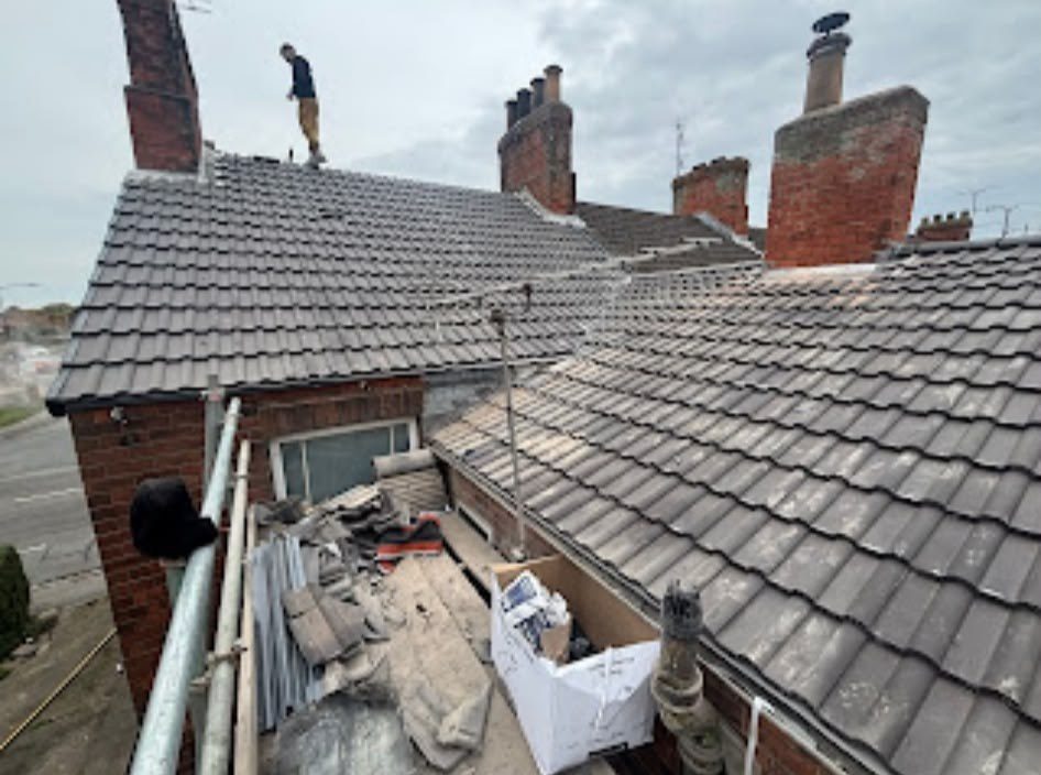 New grey tiled roof being fitted by our roofers