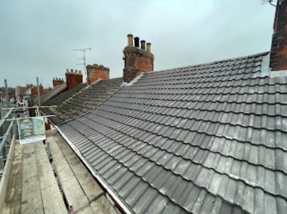 New grey tiled roof being fitted by our roofers