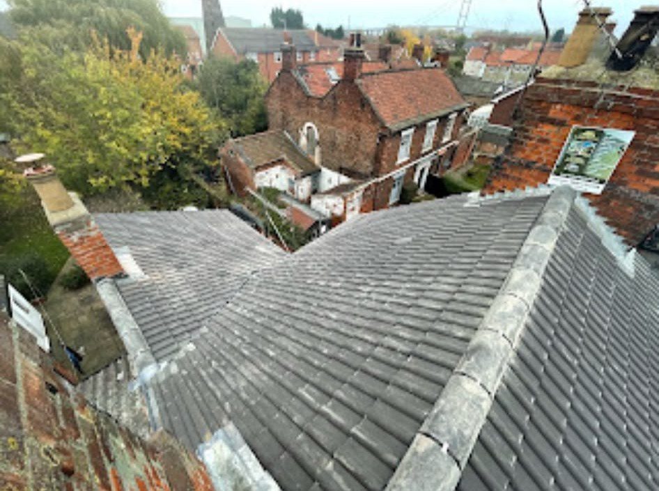 New grey tiled roof being fitted by our roofers