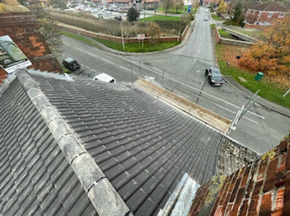 New grey tiled roof being fitted by our roofers