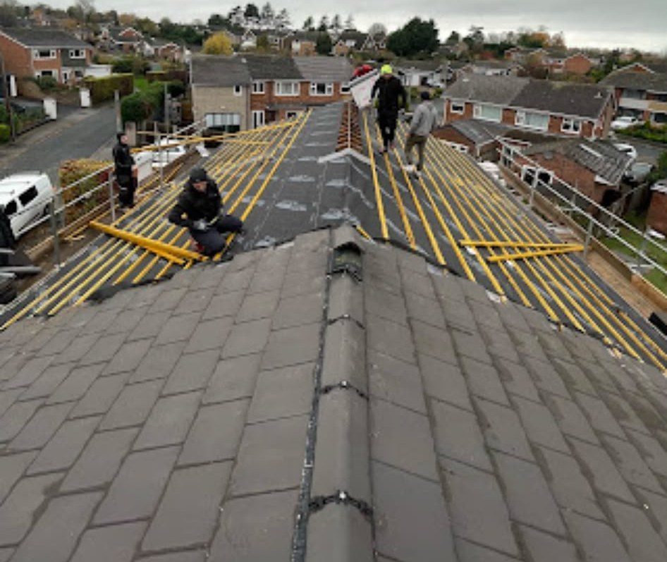 New grey tiled roof being fitted by our roofers