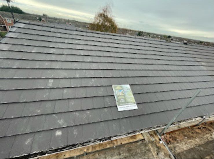 New grey tiled roof being fitted by our roofers