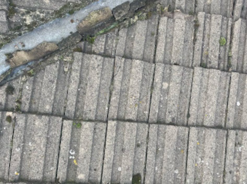Close-up of old damaged concrete roof tiles