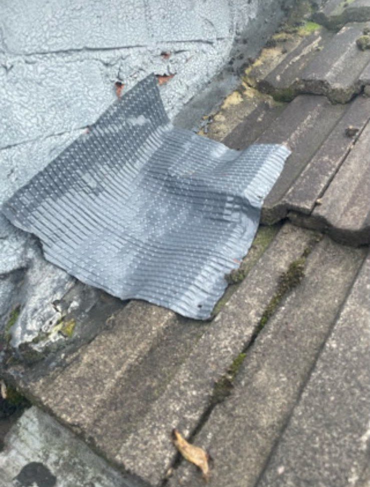 Emergency weatherproof patch on a damaged tiled roof